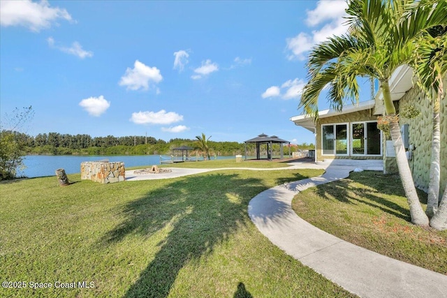 view of yard with a gazebo and a water view