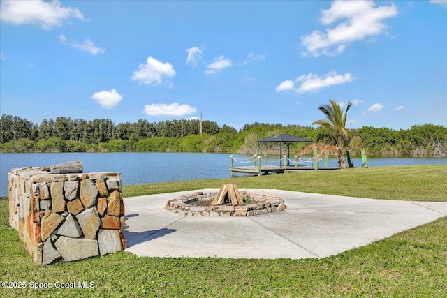 view of water feature featuring a gazebo and an outdoor fire pit