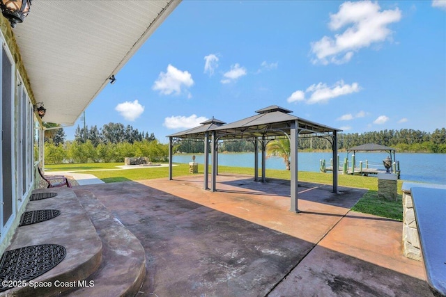 view of patio / terrace featuring a gazebo and a water view