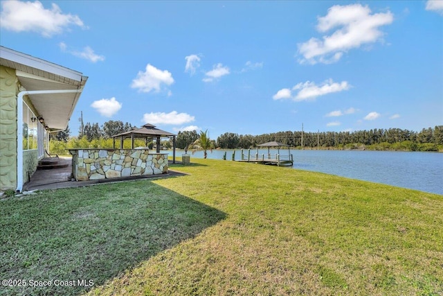 view of yard with a gazebo and a water view