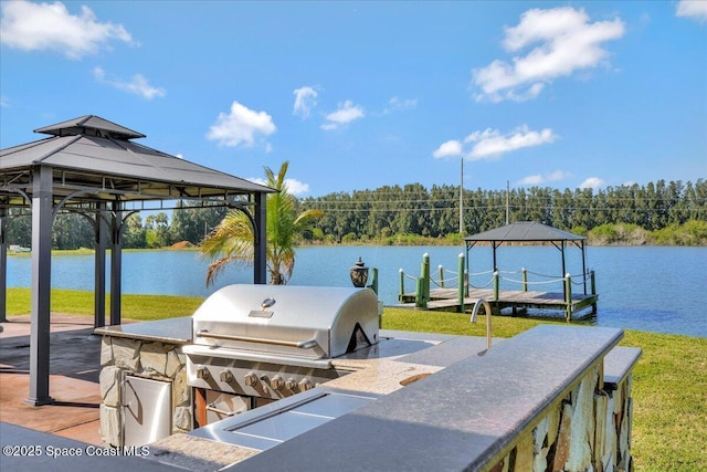 view of dock featuring a gazebo and a water view