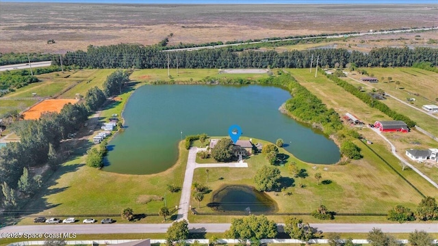 aerial view featuring a rural view and a water view