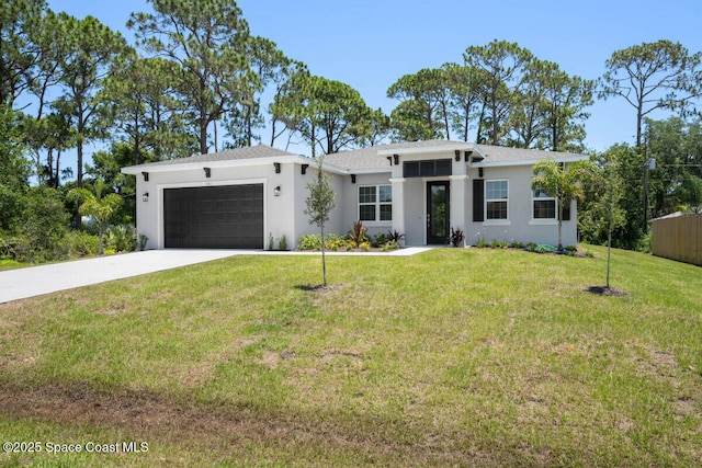 view of front facade featuring a garage and a front lawn