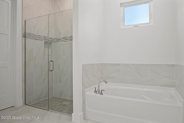 bathroom featuring shower with separate bathtub and tile patterned floors