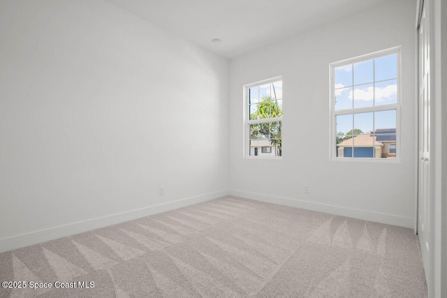 carpeted empty room featuring a healthy amount of sunlight