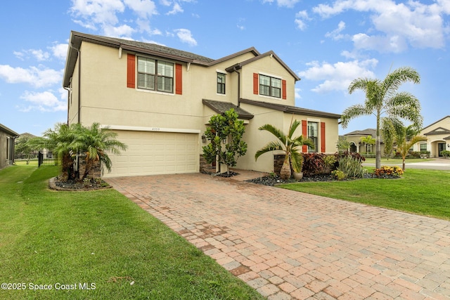 view of front of home with a garage and a front yard