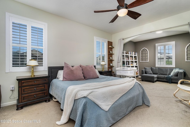 carpeted bedroom with ceiling fan