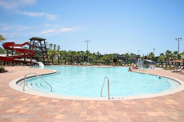 view of swimming pool featuring a water slide