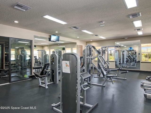 workout area with a textured ceiling