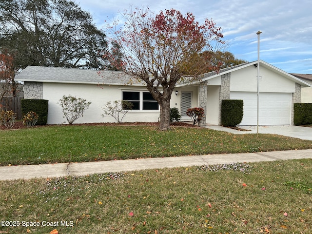 ranch-style house featuring a garage and a front lawn