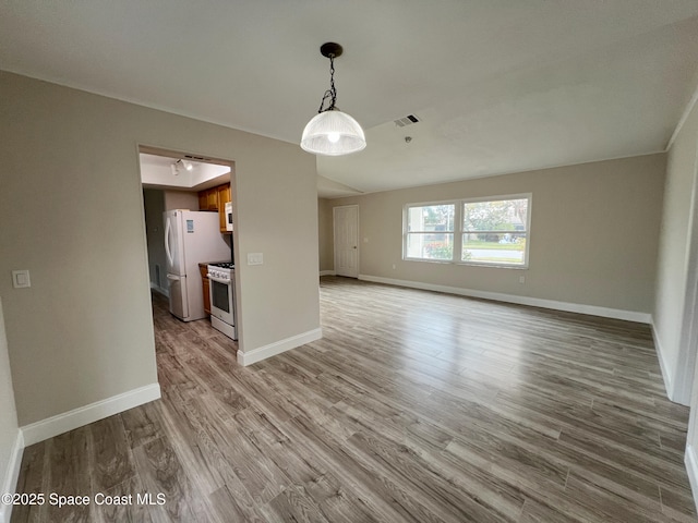 unfurnished living room with light hardwood / wood-style floors