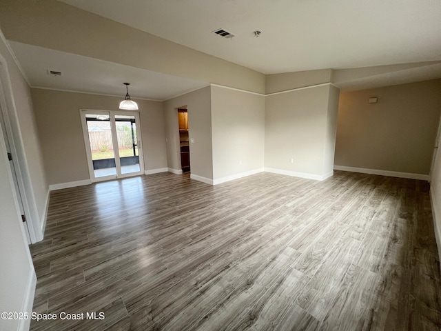 empty room with hardwood / wood-style flooring