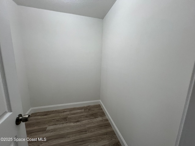 empty room with dark hardwood / wood-style floors