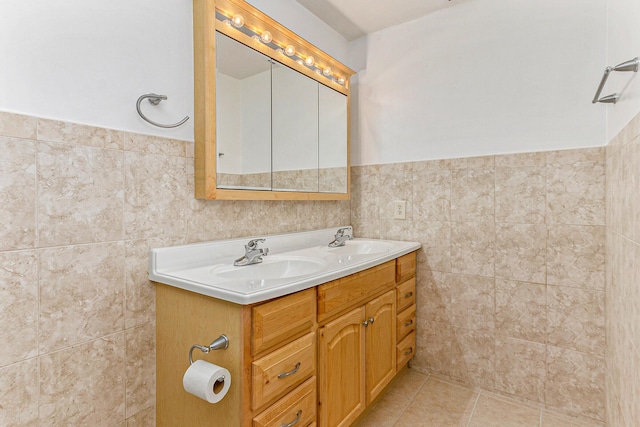 bathroom with tile patterned floors, tile walls, and vanity