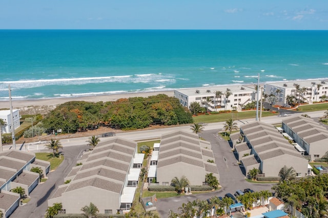 bird's eye view with a water view and a view of the beach