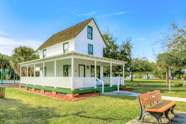 exterior space featuring a porch and a yard