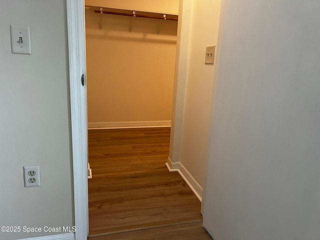 hallway featuring hardwood / wood-style flooring