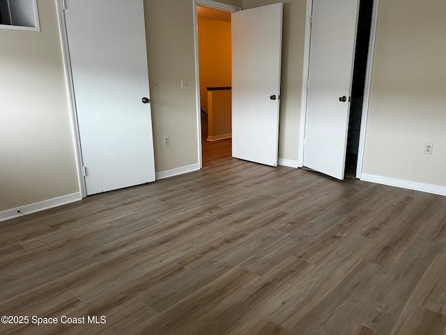 unfurnished bedroom with wood-type flooring