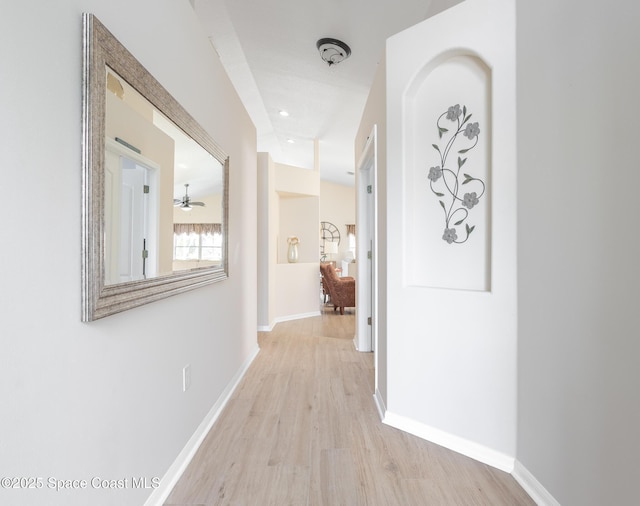 hall with light hardwood / wood-style flooring