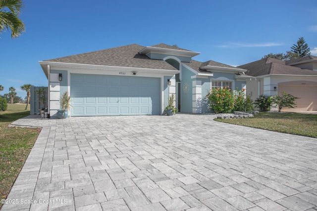 view of front of property with a garage