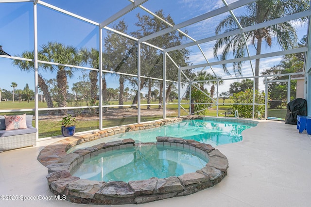 view of pool with an in ground hot tub, a lanai, and a patio area