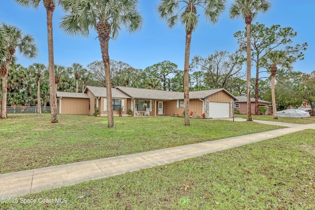 single story home featuring a garage and a front yard