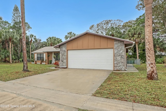 view of front of property with a garage and a front yard