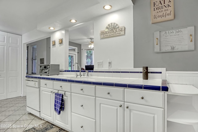 bathroom with sink, tile patterned floors, and ceiling fan