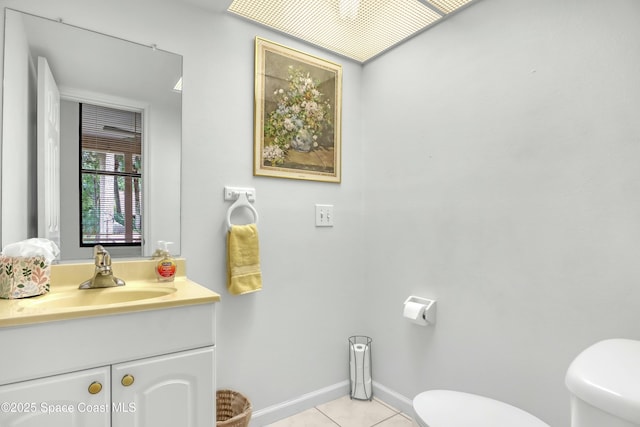 bathroom featuring toilet, tile patterned floors, and vanity