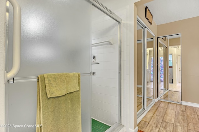 bathroom featuring an enclosed shower