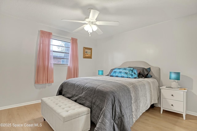 bedroom with light wood-type flooring and ceiling fan