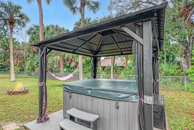 view of patio / terrace with a gazebo and a hot tub