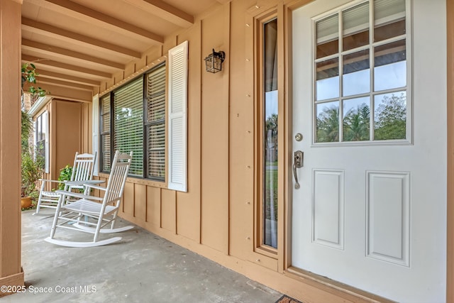 entrance to property featuring a porch