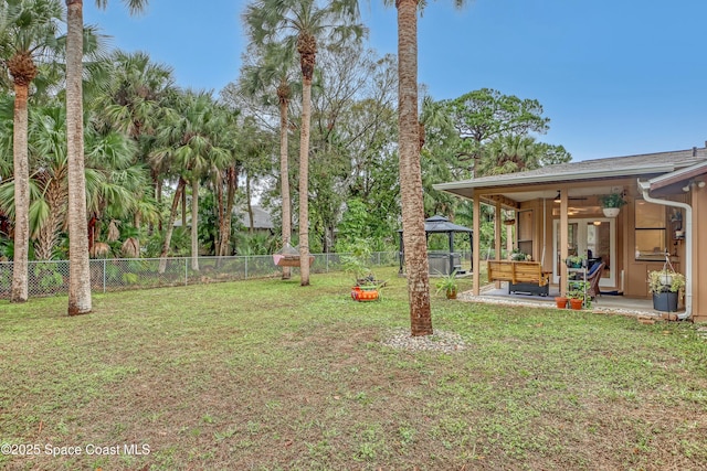 view of yard with a patio area, a gazebo, an outdoor hangout area, and ceiling fan