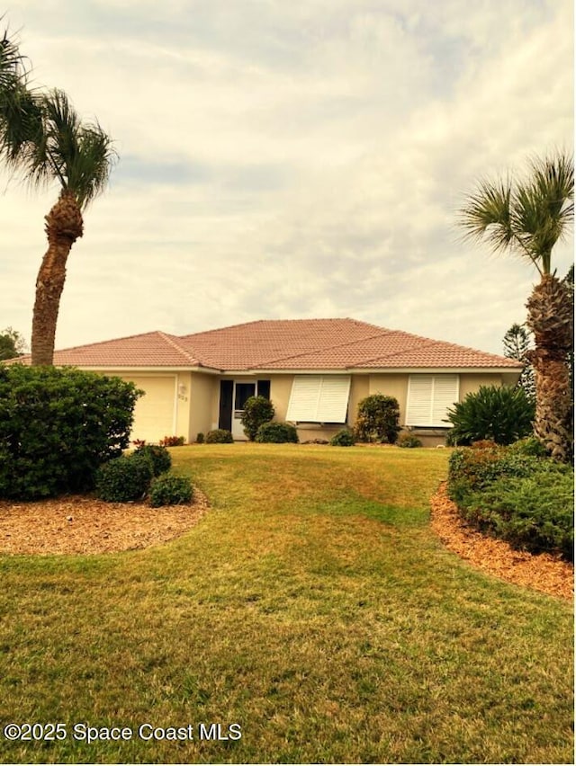 single story home with a garage and a front yard