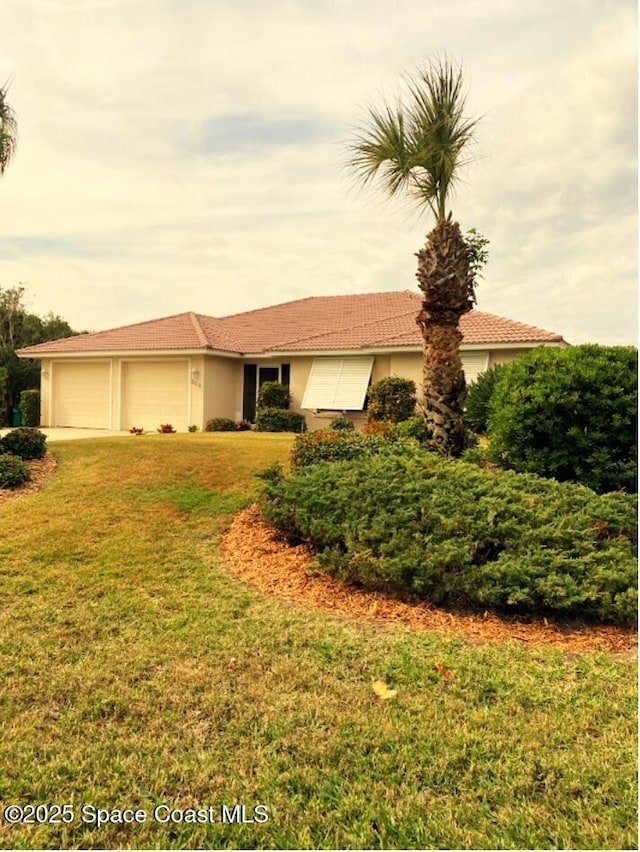 ranch-style house with a garage and a front yard