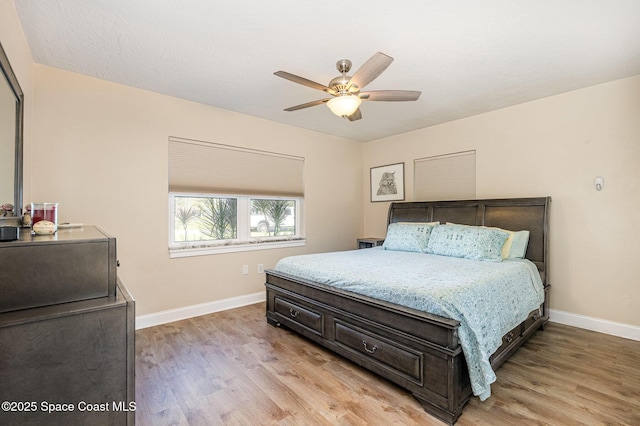 bedroom featuring light wood-type flooring and ceiling fan