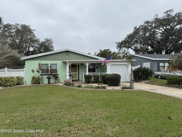 view of front of property with a garage, a front lawn, and a porch