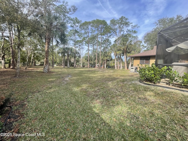 view of yard featuring a lanai