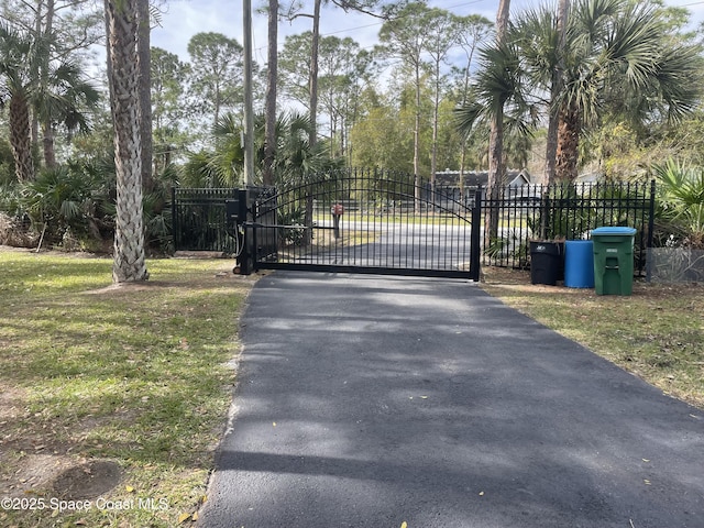 view of gate featuring fence