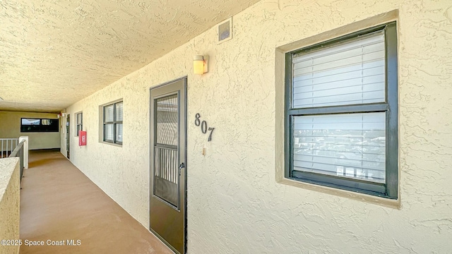 doorway to property featuring a balcony