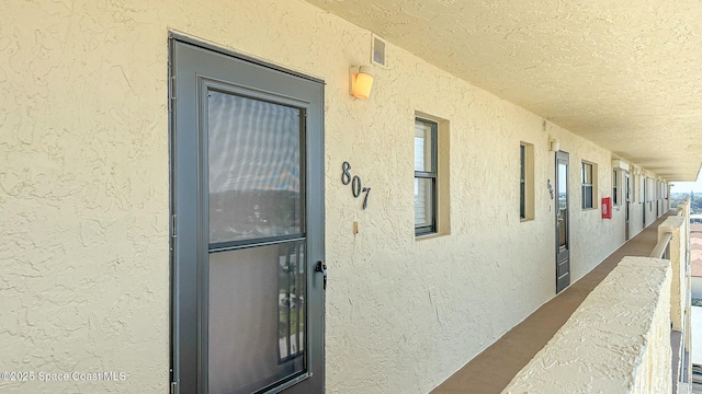 property entrance with a balcony