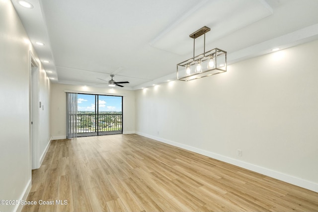 spare room featuring ceiling fan and light hardwood / wood-style flooring