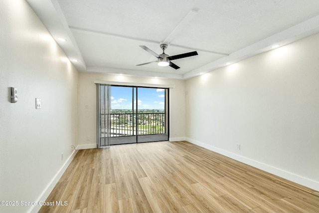 spare room featuring light hardwood / wood-style floors and ceiling fan