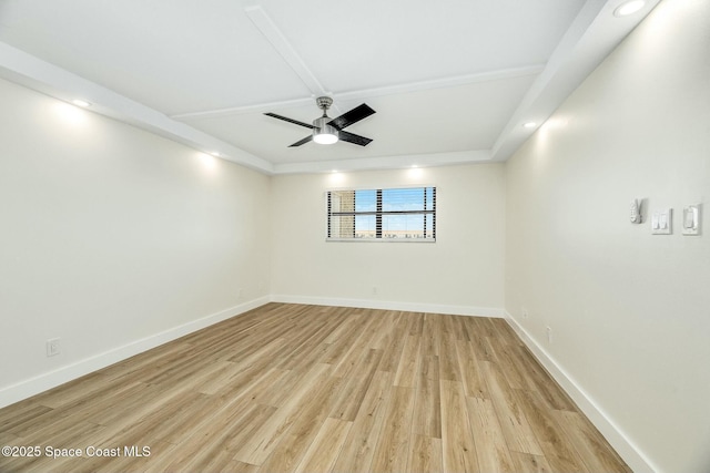 empty room featuring ceiling fan and light hardwood / wood-style floors