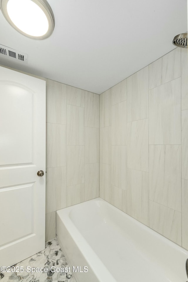 bathroom featuring shower / tub combination