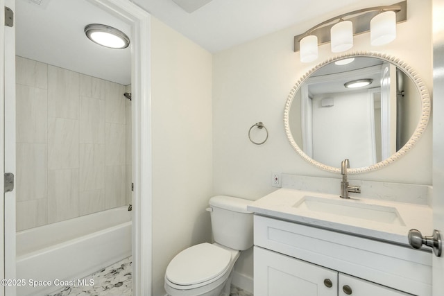 full bathroom with vanity, toilet, and tiled shower / bath combo