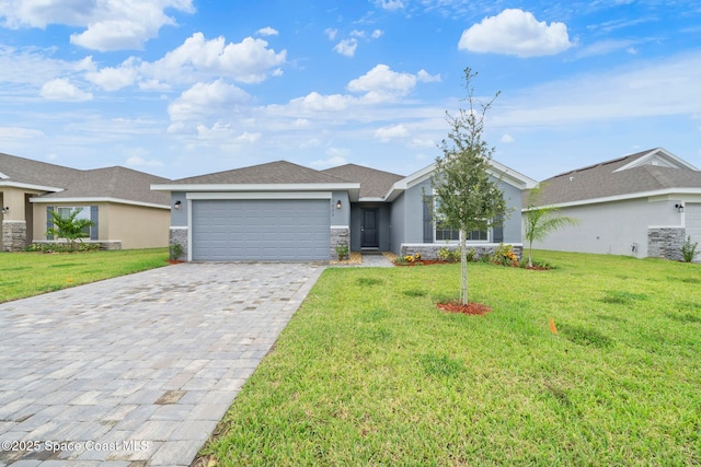 ranch-style home with a garage and a front yard