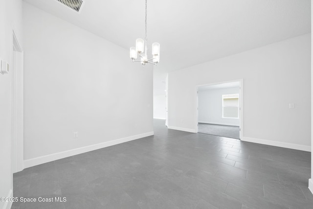 empty room with a notable chandelier