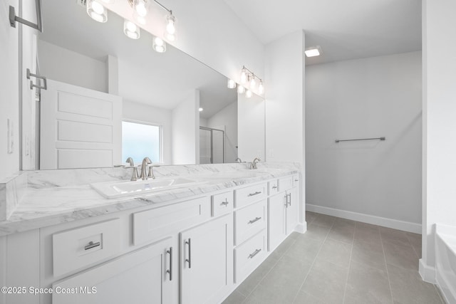 bathroom with walk in shower, tile patterned floors, and vanity